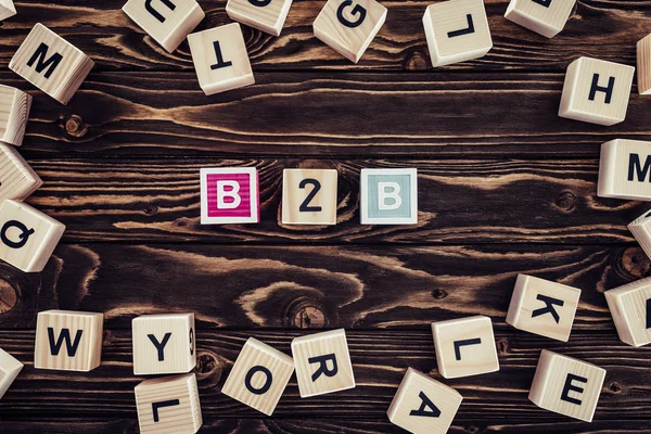 Wooden letter blocks spelling B2B concept representing B2B personalization in modern business marketing.