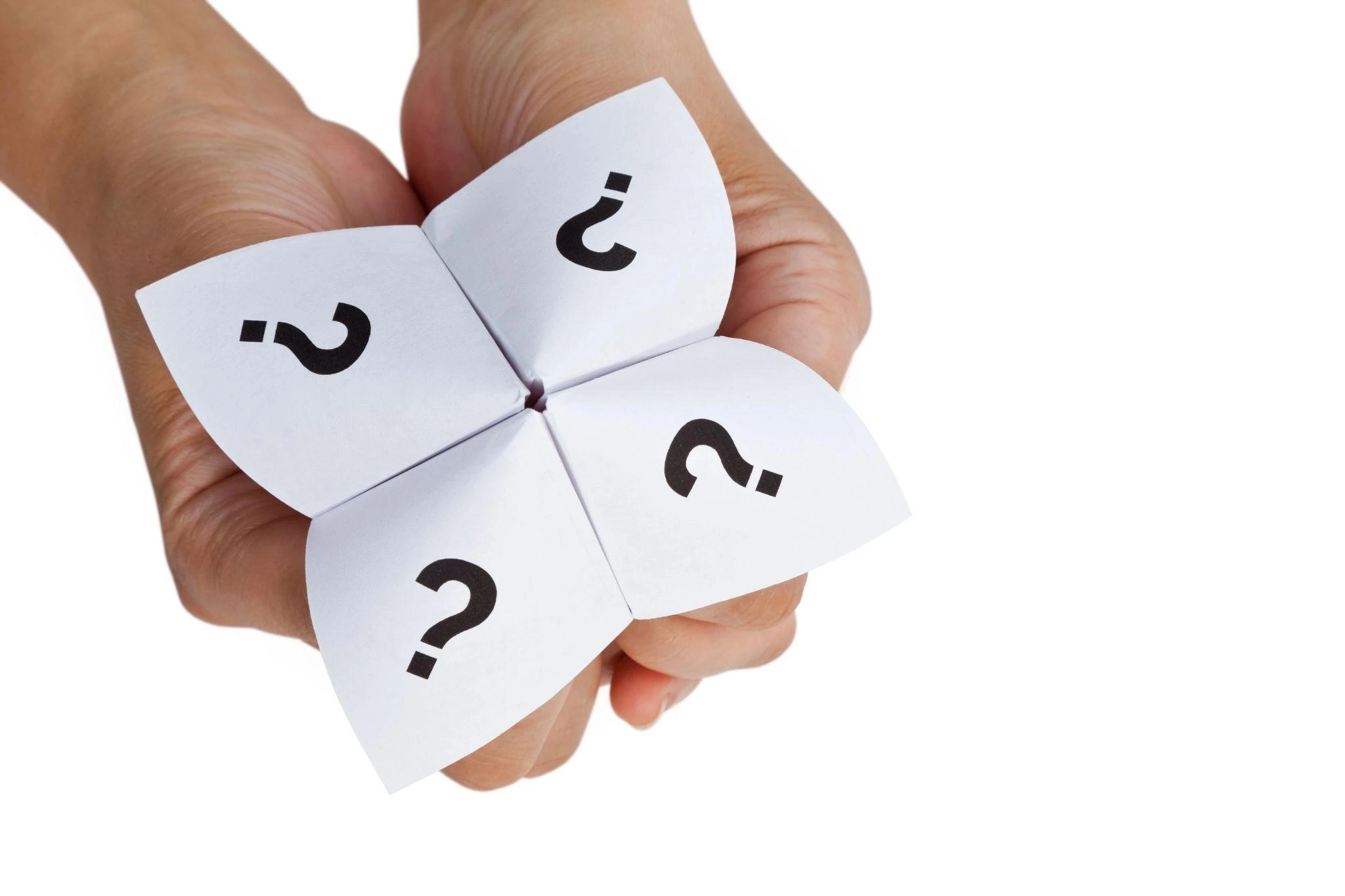 Marketing analytics frameworks concept shown by a hand holding a paper fortune teller with question marks representing data insights and decision paths.