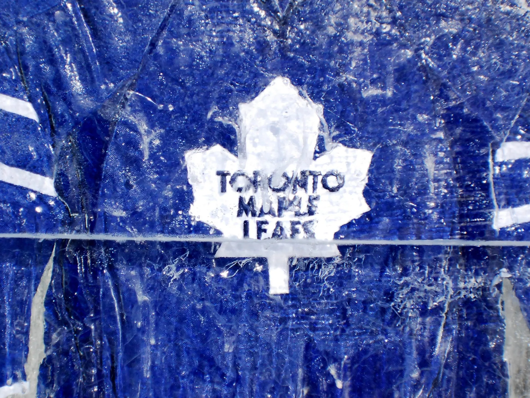 AI model predicting new product success concept illustrated by the Toronto Maple Leafs logo carved in ice against a textured blue frozen background.