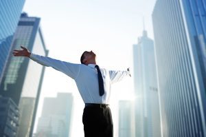 happy businessman after learning how AI readiness leadership will reshape roles
